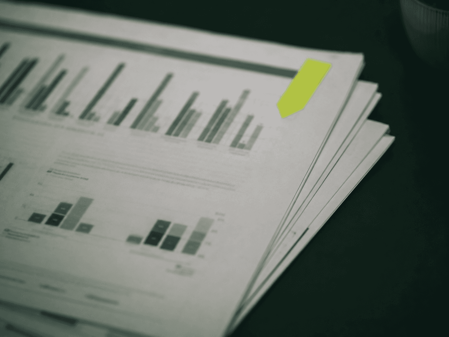 Printed workforce analytics reports with charts.